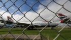 A passenger aircraft operated by British Airways, a unit of International Consolidated Airlines Group SA, on the runway at London Heathrow Airport Ltd. in London, U.K., on Saturday, Dec. 19, 2020. The pandemic has put a third of all tourism jobs at risk, and airlines around the world have said they need as much as $200 billion in bailouts.