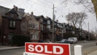 A "Sold sign" in front of homes in the Midtown neighborhood of Toronto, Ontario, Canada, on Thursday, March 11, 2021. The buying, selling and building of homes in Canada takes up a larger share of the economy than it does in any other developed country in the world, according to the Bank of International Settlements, and also soaks up a larger share of investment capital than in any of Canada’s peers. Photographer: Cole Burston/Bloomberg