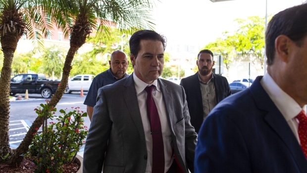 Craig Wright, center, arrives at federal court in West Palm Beach, Florida in 2019.