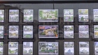 Real estate listing are displayed in a window at a Remax Choice Properties office in Toronto, Ontario, Canada, on Saturday, Feb. 15, 2020. A shrinking supply of available homes for sale in Canada's largest city continued to drive prices higher last month, bringing annual increases to the strongest in more than two years. Photographer: Brett Gundlock/Bloomberg