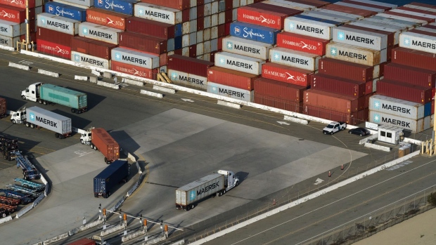 http://www.bnnbloomberg.ca/polopoly_fs/1.1707377!/fileimage/httpImage/image.jpg_gen/derivatives/landscape_620/trucks-at-the-port-of-los-angeles-in-los-angeles-california-u-s-on-tuesday-nov-16-2021-the-historic-traffic-jam-at-the-port-of-los-angeles-has-eased-slightly-as-ocean-carriers-face-fines-for-letting-cargo-linger-and-sweeper-ships-arrive-to-haul-off-empty-containers.jpg