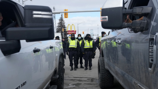 Police push back demonstrators blocking Detroit-Windsor bridge