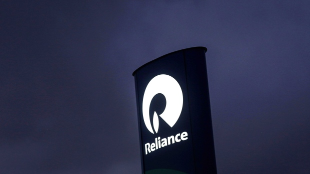 http://www.bnnbloomberg.ca/polopoly_fs/1.1731727!/fileimage/httpImage/image.jpg_gen/derivatives/landscape_620/reliance-industries-ltd-signage-at-a-gas-station-near-the-company-s-oil-refinery-in-jamnagar-gujarat-india-on-saturday-july-31-2021-the-indian-city-of-jamnagar-is-a-money-making-machine-for-asia-s-richest-man-mukesh-ambani-processing-crude-oil-into-fuel-plastics-and-chemicals-at-the-world-s-biggest-oil-refining-complex-that-can-produce-1-4-million-barrels-of-petroleum-a-day-photographer-dhiraj-singh-bloomberg.jpg