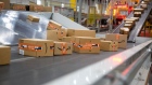 Packages move along a conveyor at an Amazon fulfillment center on Cyber Monday in Robbinsville, New Jersey, U.S., on Monday, Nov. 29, 2021. Adobe Digital Economy Index is expecting Cyber Monday to bring the biggest holiday shopping of the year, with consumers projected to spend between $10.2 billion and $11.3 billion. Photographer: Michael Nagle/Bloomberg