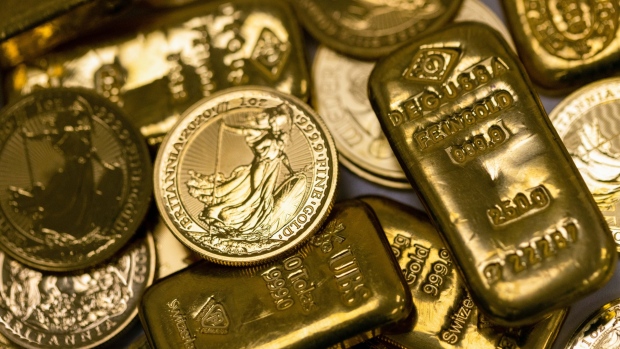 Gold rebounds from near 11-month low as U.S. dollar retreats