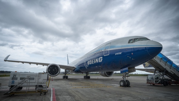 the Boeing 777X test aircraft on the tarmac at Changi Airport, in Singapore, on Sunday, Feb. 13, 2022. The plane is in Singapore as part of the Singapore International Airshow.