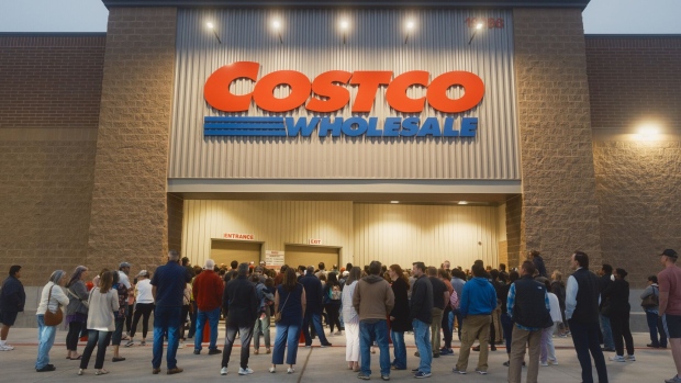 http://www.bnnbloomberg.ca/polopoly_fs/1.1975846!/fileimage/httpImage/image.jpg_gen/derivatives/landscape_620/customers-line-up-to-enter-during-the-grand-opening-of-a-costco-wholesale-store-in-kyle-texas-us-on-thursday-march-30-2023-the-new-wholesale-store-is-around-160-000-square-feet-and-the-gas-station-is-outfitted-with-24-pumps-photographer-jordan-vonderhaar-bloomberg.jpg