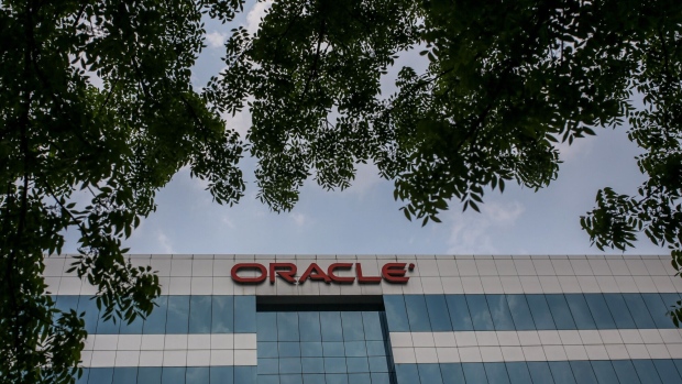 The Oracle Corp. logo atop a building housing the company's offices in the Hyderabad Information Technology and Engineering Consultancy City (HITEC City) area of Hyderabad, India, on Wednesday, March 23, 2022. India’s urban consumption is driving recovery from late pandemic wave but has further intensified the divergence between cities and the hinterland, according to a report by Citigroup Inc released last week. Photographer: Dhiraj Singh/Bloomberg