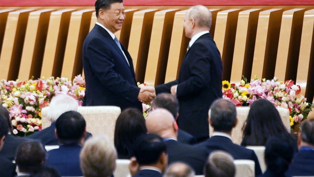 Xi Jinping shakes hands with Vladimir Putin during Belt and Road Forum in Beijing on Oct. 18, 2023.
