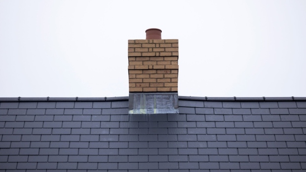 <p>The chimney stack and roof tiles of a new home.</p>