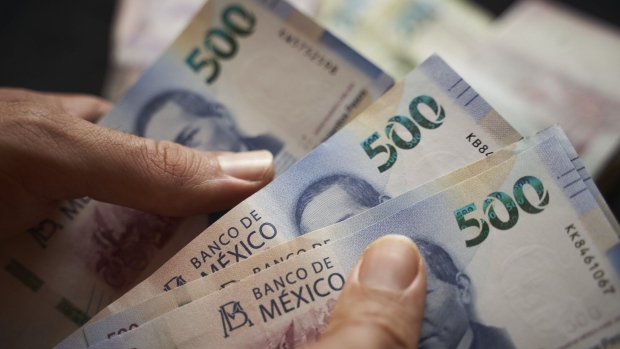 Mexican 500 peso banknotes arranged in Axtla de Terrazas, San Luis Potosi, Mexico, on Sunday, April 2, 2023. The Mexican peso is down 0.2% after inflation came in marginally below estimates, strengthening the view that the monetary tightening cycle may be over. Photographer: Mauricio Palos/Bloomberg