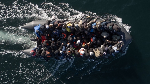 An inflatable dinghy carrying migrants crosses the English Channel on March 6, 2024. Photographer: Dan Kitwood/Getty Images