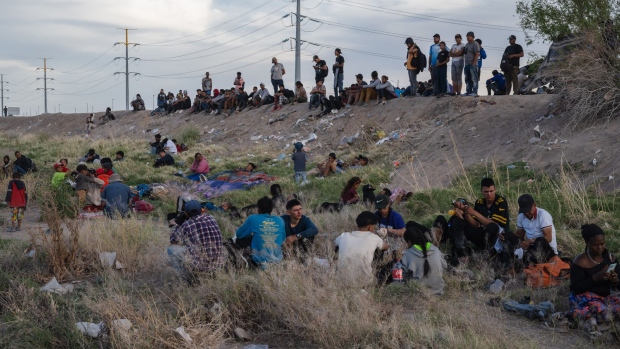 Migrants on the bank of the Rio Grande at the US-Mexico border in Ciudad Juarez, Chihuahua state, Mexico, on April 24.