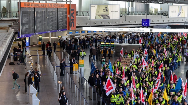 Striking workers march through Frankfurt Airport, during a strike by ground staff, in Frankfurt in February.