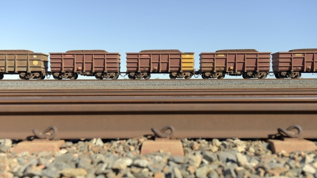 A freight train carrying iron ore travels along a track near a Rio Tinto Group rail yard in Karratha, Western Australia, Australia, on Wednesday, June 22, 2022. Iron ore is on course to end the week lower, with the increase in Chinese steel plants being idled and swelling inventories seen as signs of stagnant demand. Photographer: Carla Gottgens/Bloomberg