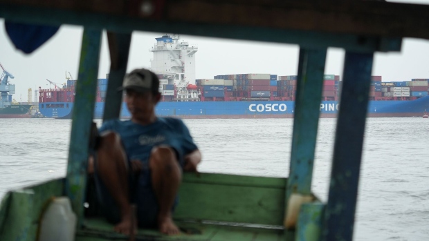 The Xin Tai Cang container ship, rear, departs the Tanjung Priok Port in Jakarta, Indonesia, on Friday, April 19, 2024. Indonesia will release its trading figures on April 22. Photographer: Dimas Ardian/Bloomberg