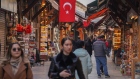 <p>A Turkish national flag hangs above the Arasta Bazaar in Istanbul, Turkey.</p>