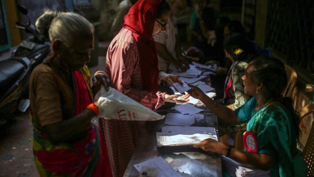 <p>Voters register at a polling station during the first phase of voting for national elections in Chennai, Tamil Nadu, India, on April 19.</p>