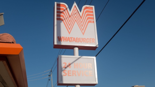 A sign for a 24 hour Whataburger in Phoenix, Arizona. Photographer: Epics/Getty Images