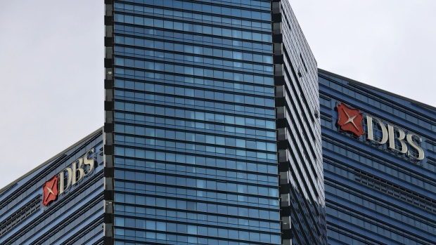 Signage atop the DBS Group Holdings Ltd. headquarters building in Singapore, on Wednesday, Feb. 7, 2024. DBS's fourth-quarter profit came in short of analyst expectations amid signs of pressure on margins. Photographer: Suhaimi Abdullah/Bloomberg