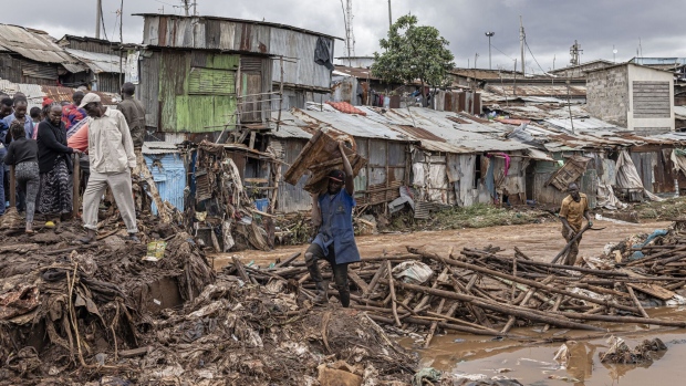 Residents among the debris following heavy rains in the informal settlement of Mathare in Nairobi, Kenya, on April 25.