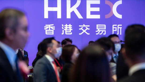 Signage for Hong Kong Exchanges and Clearing Ltd. (HKEx) during the listing ceremony for the CSOP Bitcoin Futures and CSOP Ether Futures exchange-traded funds (ETFs) at the Hong Kong Stock Exchange in Hong Kong, China, on Friday, Dec. 16, 2022. A pair of Hong Kong ETFs investing in Bitcoin and Ether futures raised $79 million as the city pushes ahead with a plan to become a crypto hub even as the sector globally reels from the FTX collapse. Photographer: Paul Yeung/Bloomberg