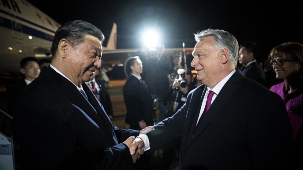 Viktor Orban greets Xi Jinping at Liszt Ferenc Budapest airport in Ferihegy, Hungary on May 8. Photographer: Vivien Cher Benko/AFP/Getty Images
