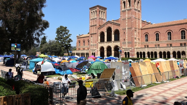 UCLA campus security gather outside a pro-Palestinian encampment at the University of California, Los Angeles campus on April 30.