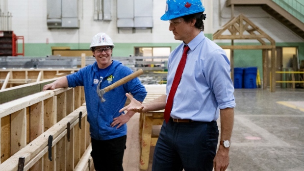 Justin Trudeau, flips a hammer at the College of Carpenters and Allied Trades Training Centre in Woodbridge, Ontario, Canada, on Friday, April 12, 2024.