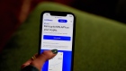 The Coinbase website on a smartphone arranged in the Brooklyn borough of New York, US, on Wednesday, June 7, 2023. The list of digital tokens deemed as unregistered securities by the Securities and Exchange Commission now spans over $120 billion of crypto after the US agencys lawsuits against Binance Holdings Ltd. and Coinbase Global Inc. Photographer: Gabby Jones/Bloomberg