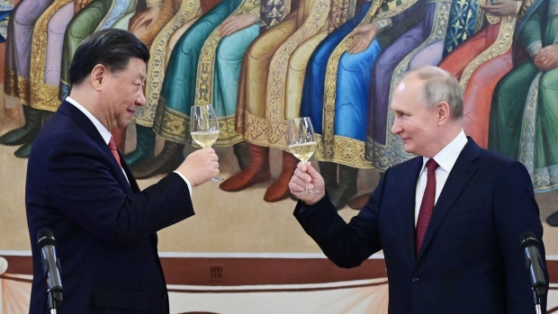 Xi Jinping and Vladimir Putin. Photographer: Pavel Byrkin/AFP/Getty Images