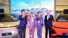 Brian Gu, co-president of Xpeng Inc., second right, during the company's showcase event in Hong Kong.