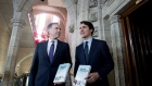 Minister of Finance Bill Morneau walks with Prime Minister Justin Trudeau