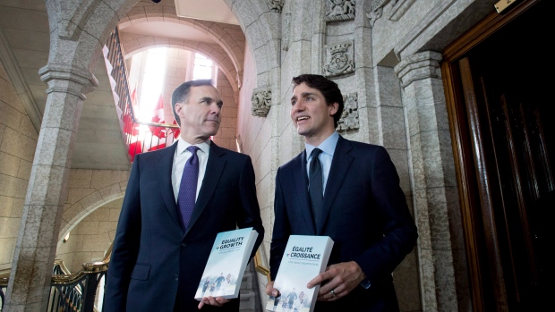 Minister of Finance Bill Morneau walks with Prime Minister Justin Trudeau