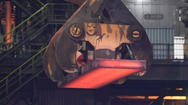 Steel is loaded at a plant of German steel manufacturer Salzgitter AG in Salzgitter, Germany