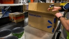 An employee packages products inside a Wal-Mart Stores Inc. fulfillment center in Bethlehem