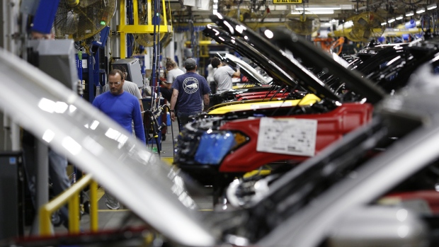 Employees work as Ford Motor Co. Expedition SUVs sit on assembly line at Ford Kentucky Truck Plant