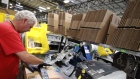 A worker prepares a package for shipment at the Amazon.com fulfillment centre in Kenosha, Wisconsin