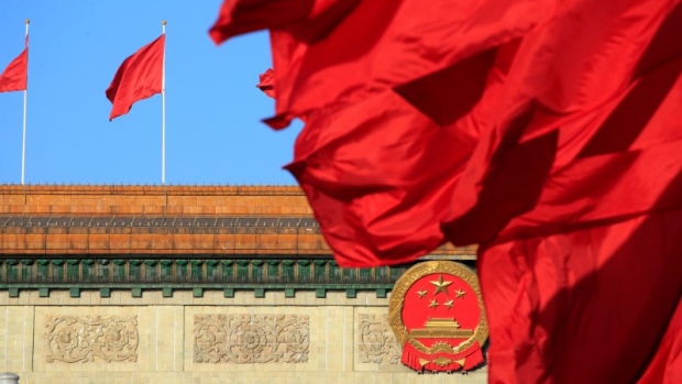 Red flags flutter outside the Great Hall of the People before the second plenary session of the CPPCC in Beijing