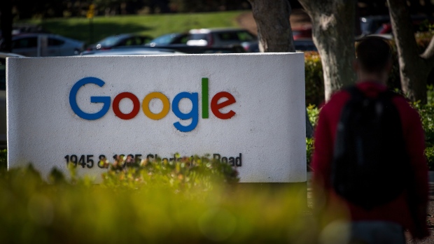 A pedestrian walks past signage at Google Inc. headquarters in Mountain View, California, U.S., on Wednesday, April 25, 2018. Alphabet Inc. is pushing efforts to roll back the most comprehensive biometric privacy law in the U.S., even as the company and its peers face heightened scrutiny after the unauthorized sharing of data at Facebook Inc.