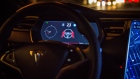 An instrument panel with the Tesla Motors Inc. 8.0 software update displays an autopilot disengagement warning inside a Model S P90D vehicle in the Brooklyn borough of New York, U.S.