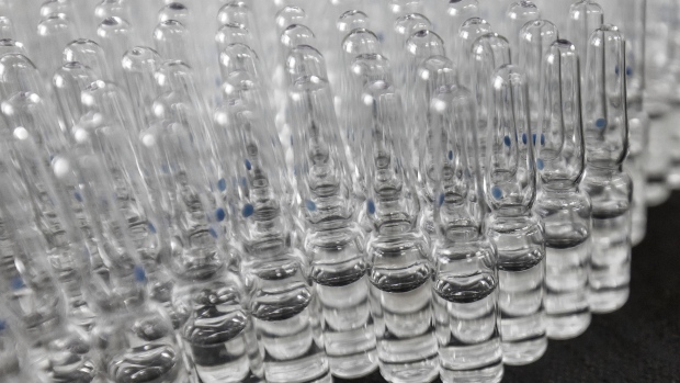 Vials of adrenaline hydrochloride injection solution are seen on a production line at a China Grand Pharmaceutical and Healthcare Holdings Ltd. facility in Wuhan, China, on Tuesday, June 13, 2017. ChinaGrandPharma mainly aims to export finished drugs to developing markets and hasnt faced regulatory actions from the U.S. or European drug quality watchdogs, according to the company.