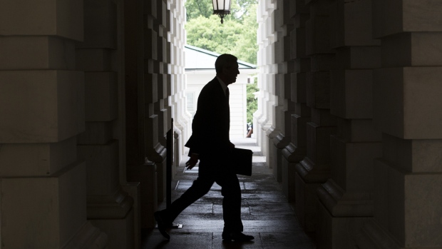 The silhouette of Robert Mueller, former director of the Federal Bureau of Investigation (FBI) and special counsel for the U.S. Department of Justice, is seen as he leaves the U.S. Capitol Building following a meeting with the Senate Judiciary Committee in Washington, D.C., U.S., on Tuesday, June 20, 2017.