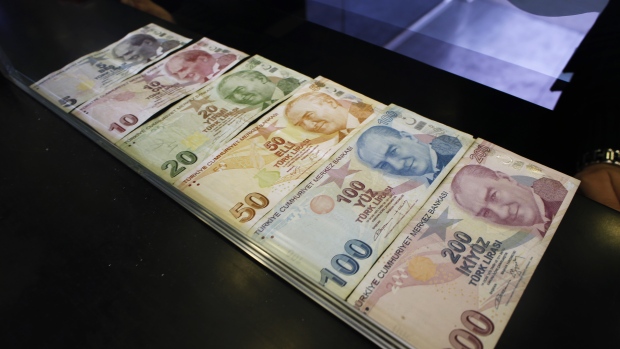 Turkish lira banknotes sit in this arranged photograph at a currency exchange in Istanbul, Turkey, on Friday, March 16, 2018. As Turkish markets tumble, investor attention is turning once more to the central bank for signs it’s willing to backstop the nation’s assets.
