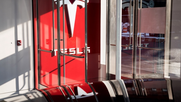 Signage is displayed at the entrance to the new Tesla Inc. showroom in New York.
