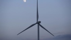 The moon is seen behind a wind turbine at the Subplu wind farm, operated by Gunkul Engineering Pcl., in Huay Bong, Thailand, on Thursday, Nov. 2, 2017. Gunkul, the most expensive energy stock in Thailand, plans to invest more than 20 billion baht ($599 million) in Japanese solar projects to boost earnings growth. 