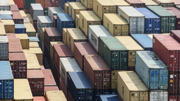 Shipping containers stand in a terminal at the Yangshan Deep Water Port in Shanghai, China, on Friday, March 23, 2018.