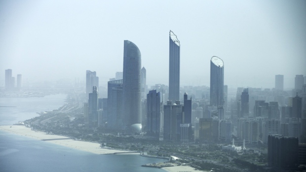 Residential and commercial skyscrapers stand along the coastline in Abu Dhabi, United Arab Emirates, on Tuesday, April 10, 2018. 