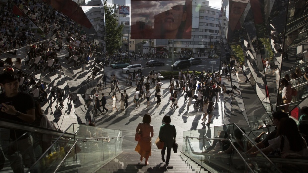 Two women walk down a flight of stairs at the entrance to the Tokyu Plaza Omotesando Harajuku shopping complex in Tokyo, Japan, on Saturday, Sept. 3, 2016.  Photographer: Tomohiro Ohsumi/Bloomberg