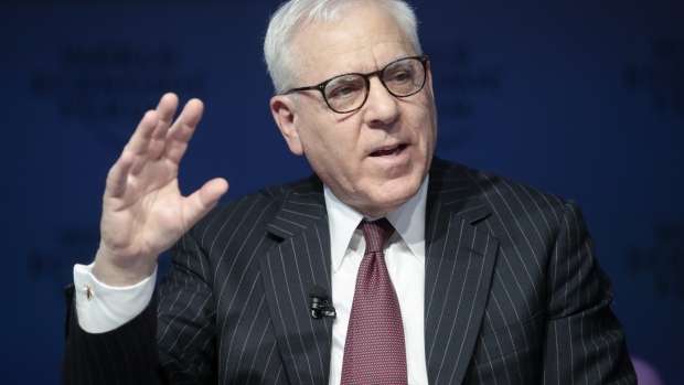 David Rubenstein, co-chief executive officer of the Carlyle Group LP, poses for a photograph following a Bloomberg Television interview on day two of the World Economic Forum (WEF) in Davos, Switzerland, on Wednesday, Jan. 24, 2018. World leaders, influential executives, bankers and policy makers attend the 48th annual meeting of the World Economic Forum in Davos from Jan. 23 - 26. Photographer: Simon Dawson/Bloomberg